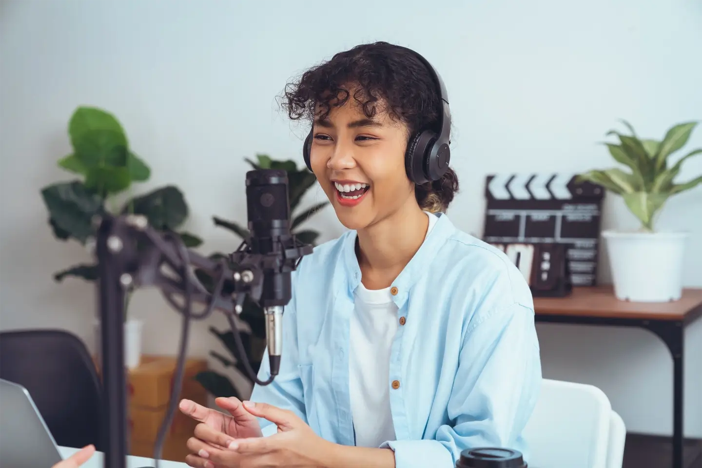 woman use microphones wear headphones with laptop record podcast for radio. Content creator concept.