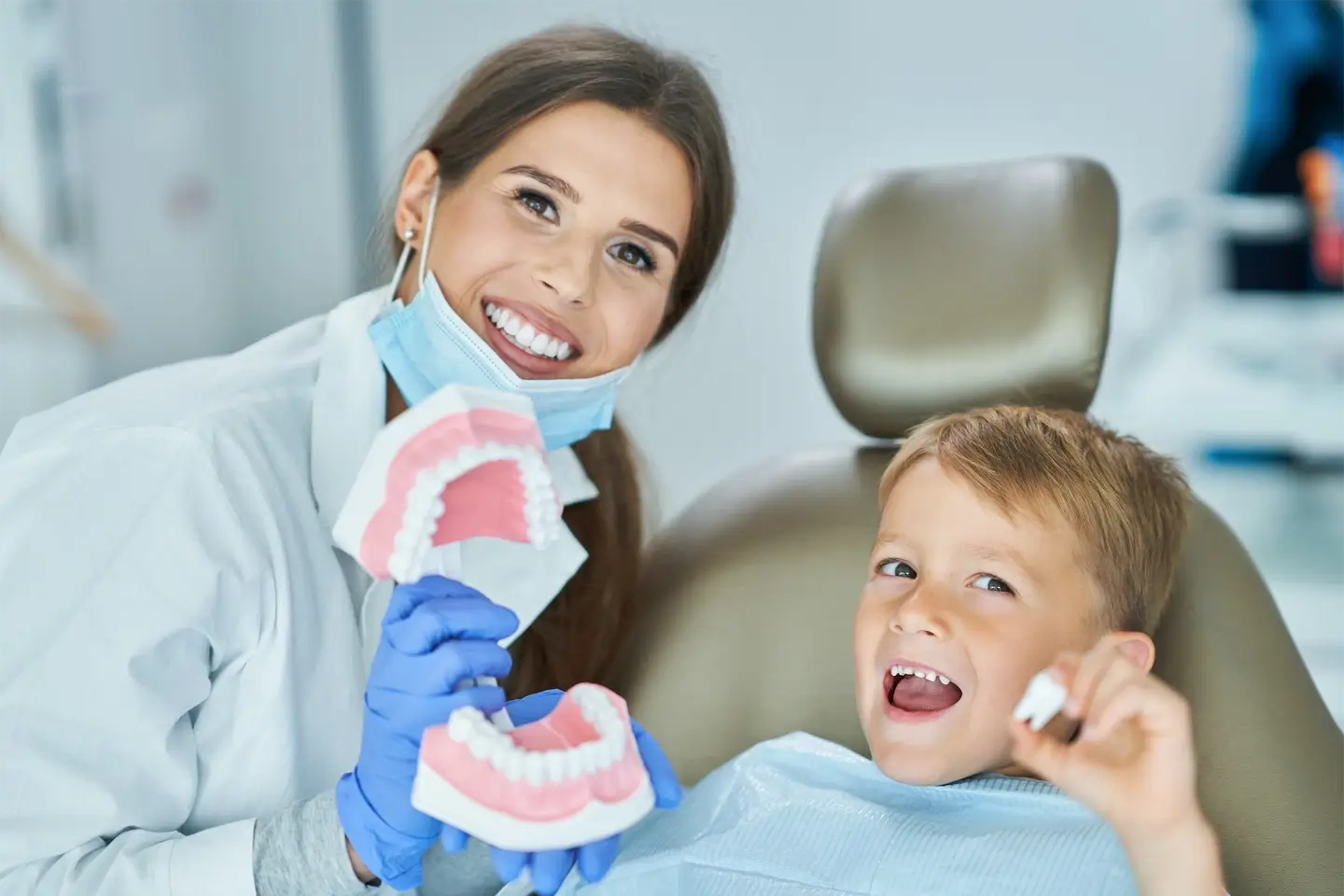 Little boy and female dentist in the dentists office