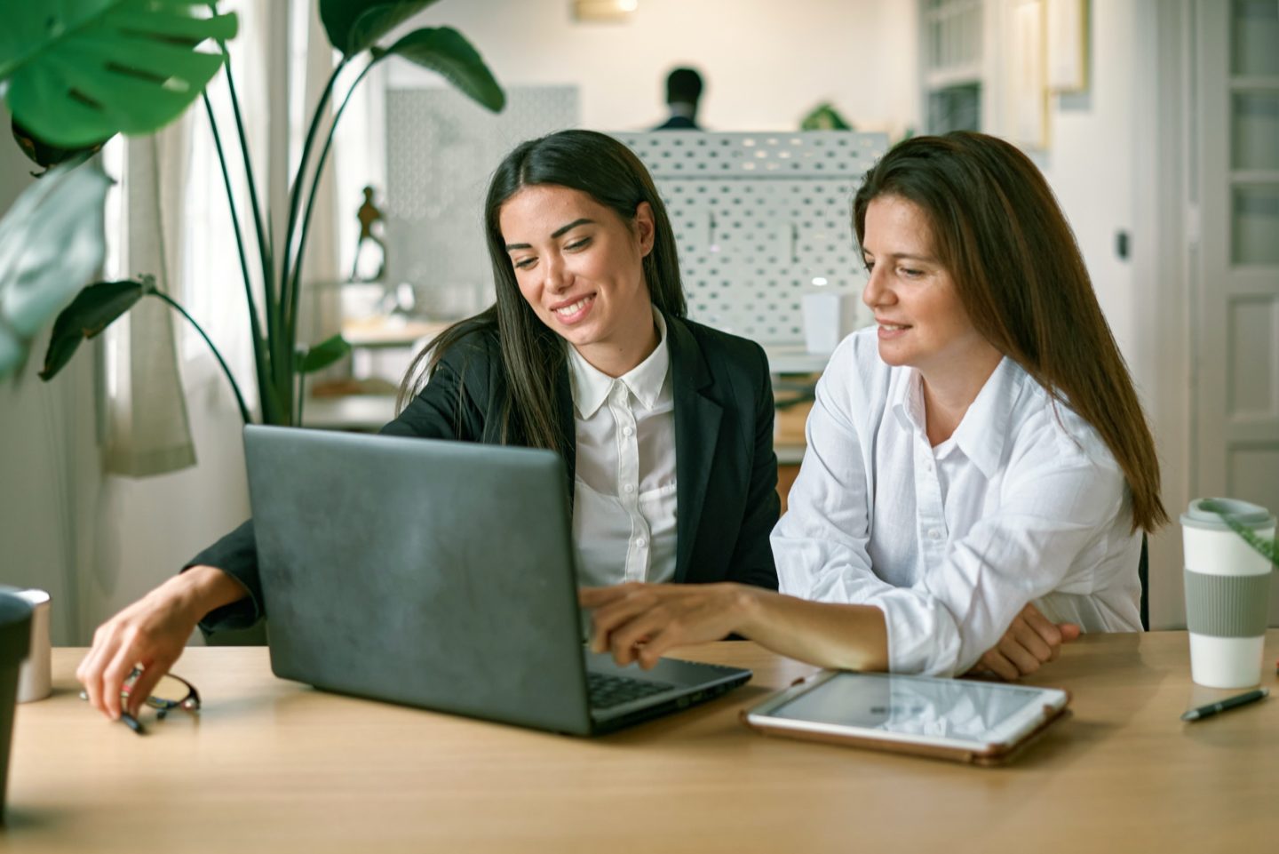 Female employees working on project together