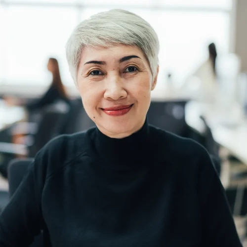 portrait-of-asian-senior-female-manager-at-desk-in-the-office.webp