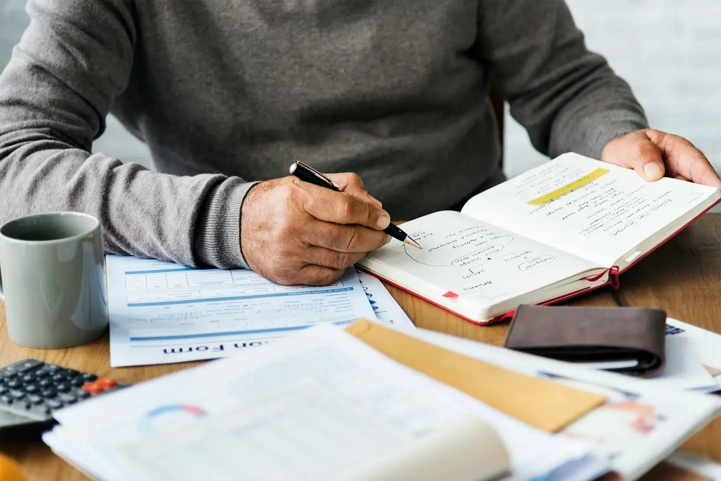 Senior man writing down some notes