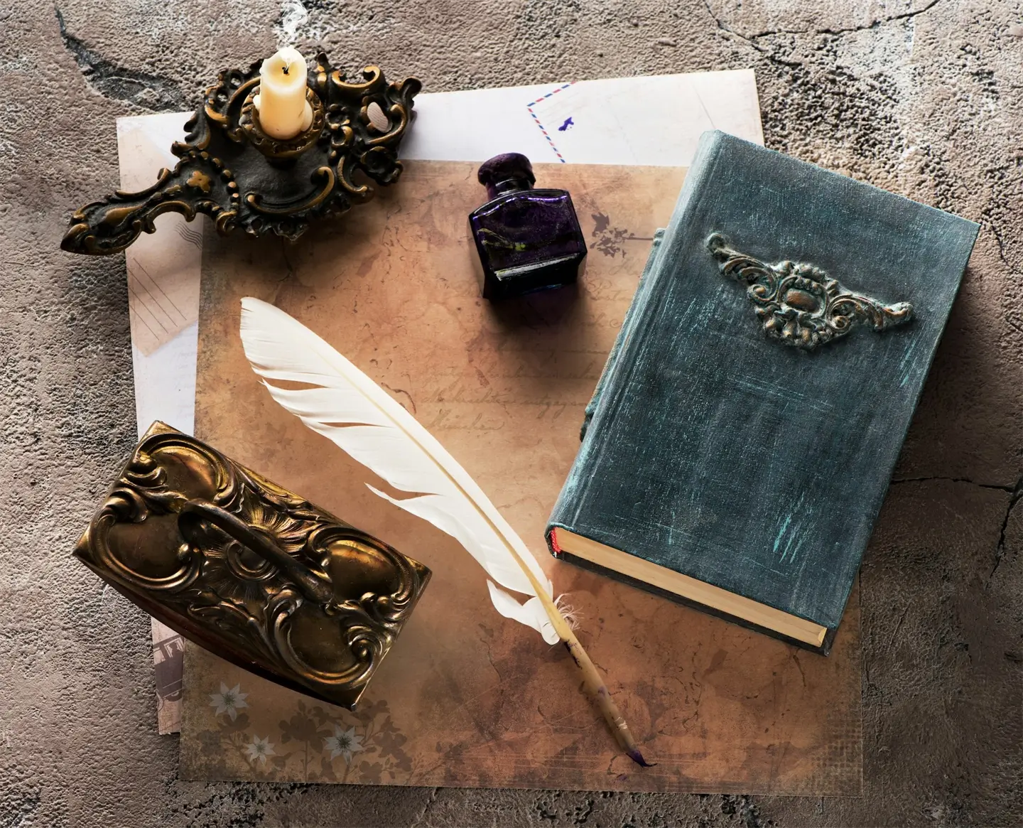 Vintage books, press papier, pencil, quill pen and ink.   Still life with items for writing